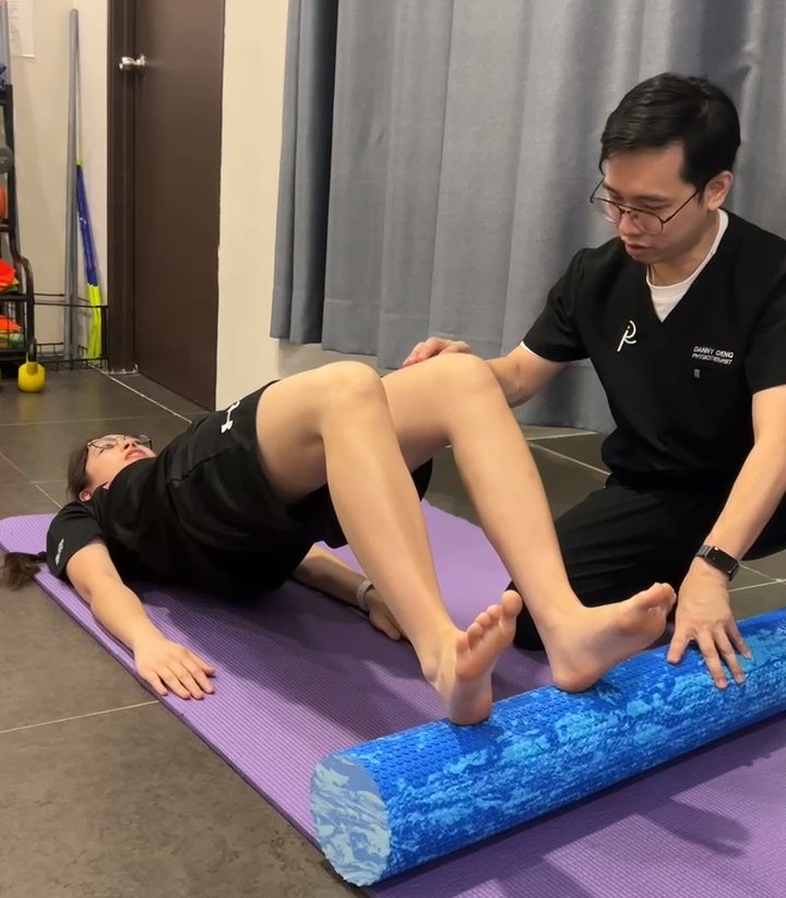 Physiotherapist treating knee osteoarthritis with exercise at Relive Physiotherapy, Petaling Jaya